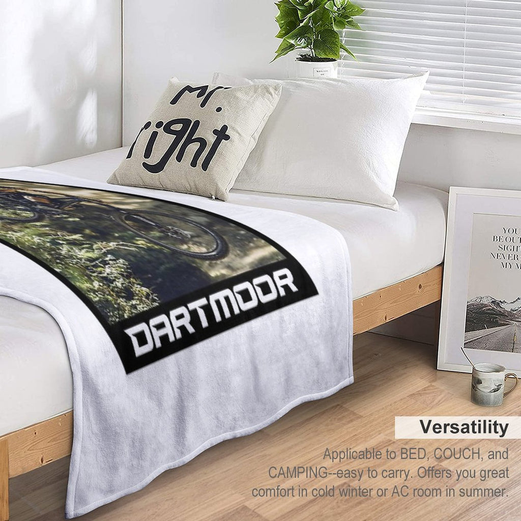 Cyclist Jumping with His Dartmoor Bikes Travel-friendly Throw Blanket