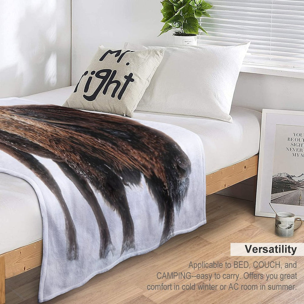 An American Bison Moves Through A Winter Snowstorm Versatility Throw Blanket
