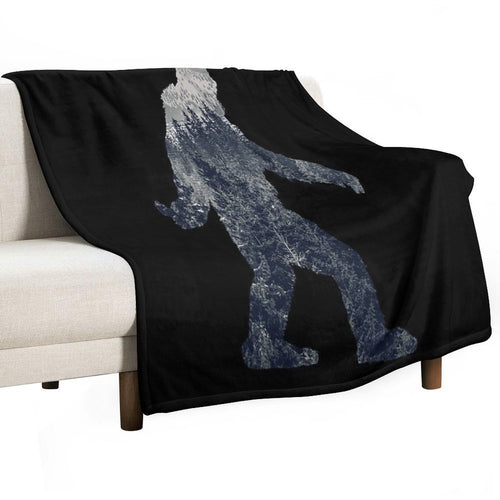 A Sasquatch Silhouette in The North Velvety-soft Throw Blanket